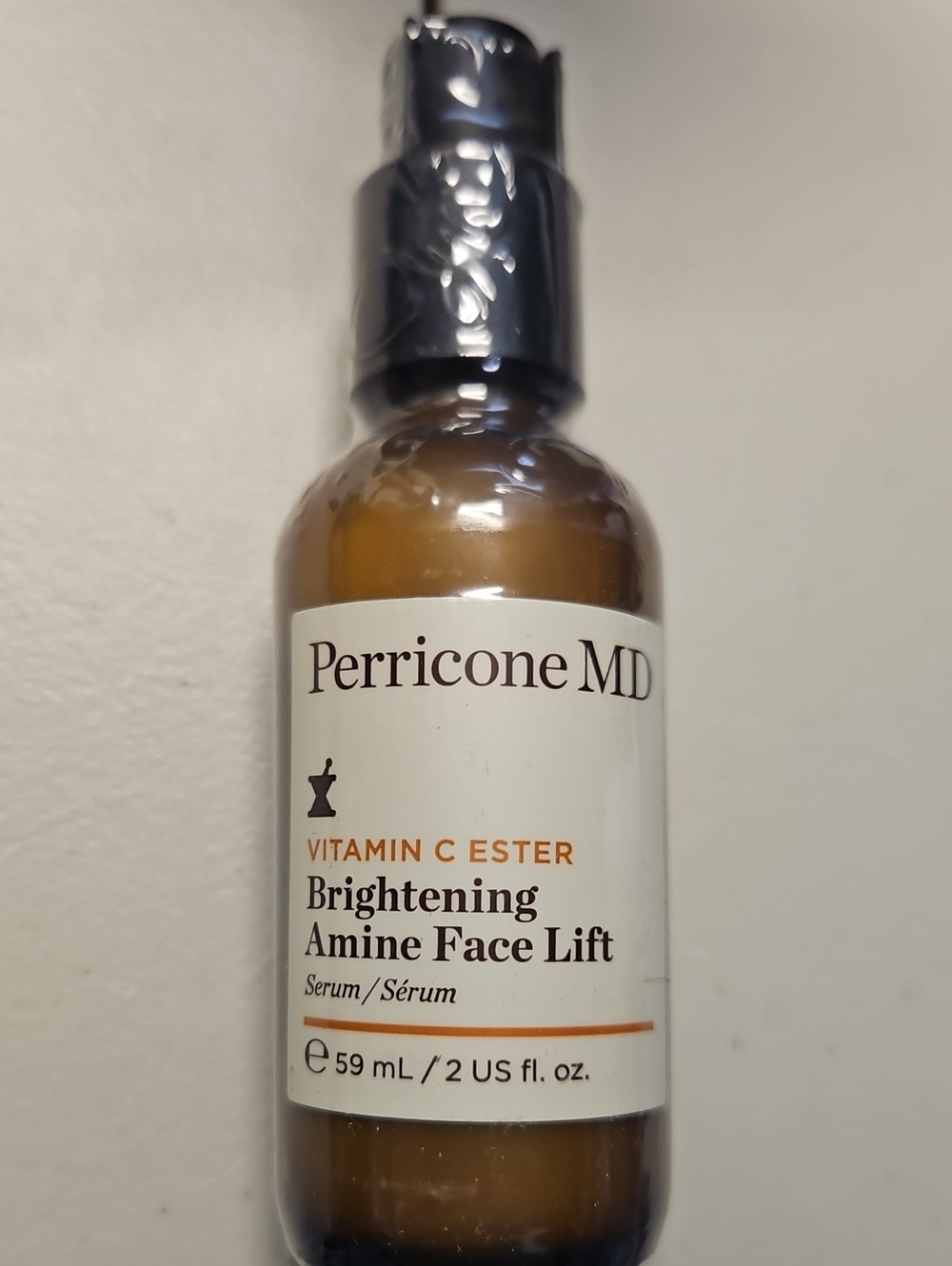 Perricone MD Brightening Serum Bottle — Amber and White